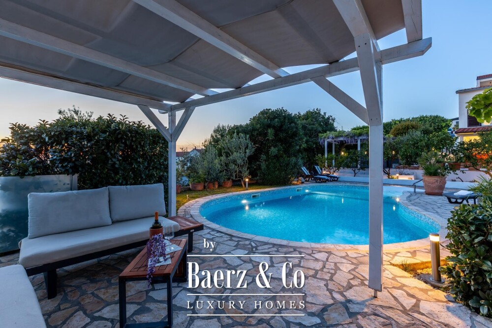 Rogoznica, a beautiful villa with a pool, a view of the sea and a hidden garden image