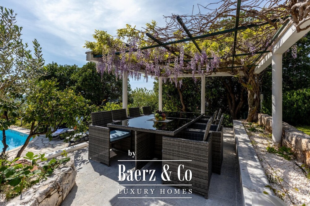 Rogoznica, a beautiful villa with a pool, a view of the sea and a hidden garden image