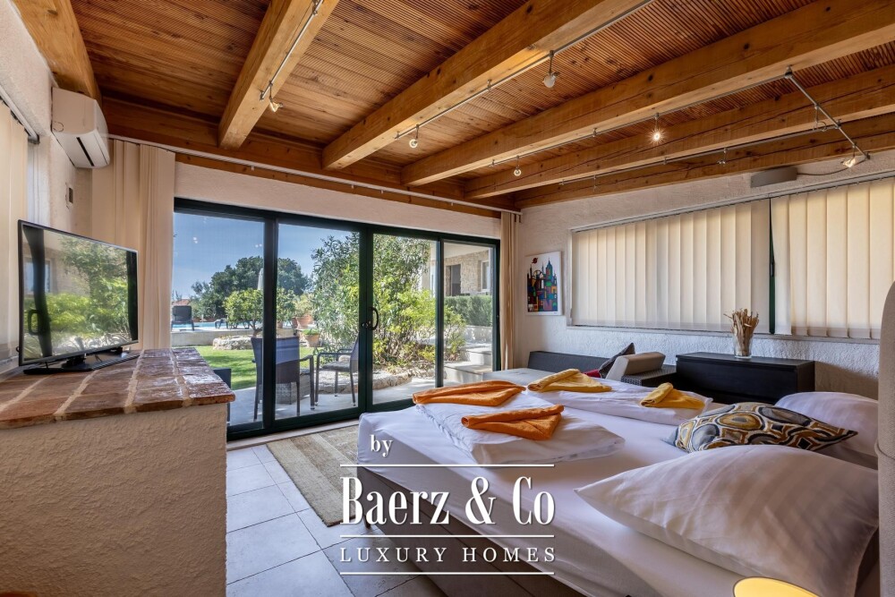 Rogoznica, a beautiful villa with a pool, a view of the sea and a hidden garden image