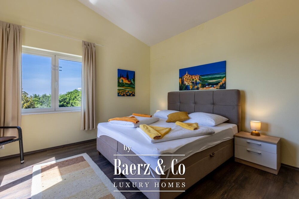 Rogoznica, a beautiful villa with a pool, a view of the sea and a hidden garden image