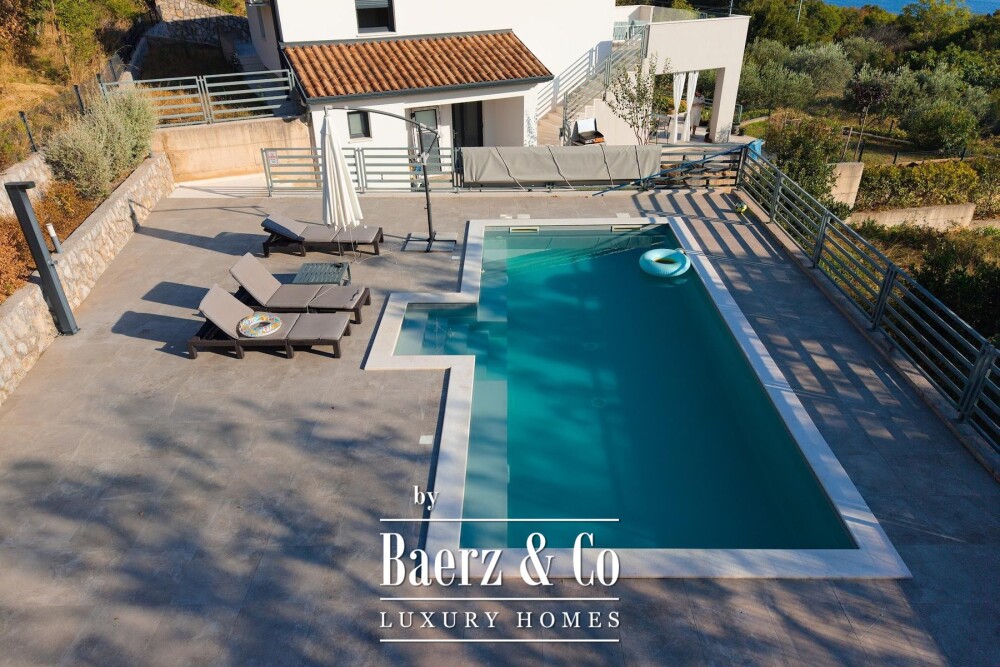 Kostrena, a house with a swimming pool and a stunning open sea view image